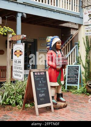 Cigar store indian or wooden indian stands in front of  a business in St Augustine Florida, USA. Stock Photo