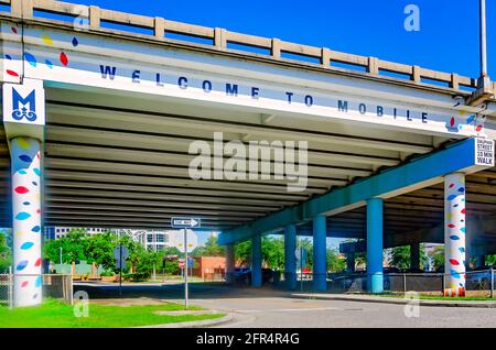 “Welcome to Mobile” is painted on the Interstate-10 overpass near the Alabama Cruise Terminal, May 14, 2021, in Mobile, Alabama. Stock Photo