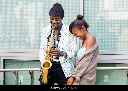 African couple playing Saxophone Stock Photo