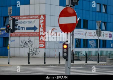 WARSAW. POLAND - AUGUST 2015: No entry sign on the background of the shopping center, traffic light, yellow light is on. High quality photo Stock Photo