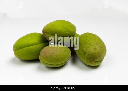 unripe almonds on white background Stock Photo