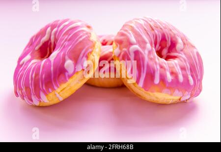 Closeup of ring doughnuts with decorative icing . Stock Photo