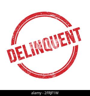 DELINQUENT text written on red grungy vintage round stamp. Stock Photo