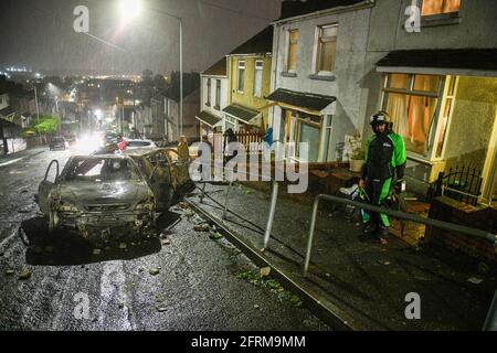 The aftermath of a riot in the Mayhill area of Swansea, which saw police attacked and several cars in the area torched during large scale disorder on the council estate. It is believed locals reacted when police turned up to a memorial that was taking place for a local man who had recently died. Stock Photo