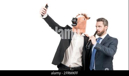 Try to hold it steady. Drunk coworkers take selfie video on smartphone. Video recording Stock Photo
