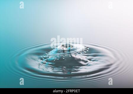 Collision ripple splash of two drops falling into the water Stock Photo