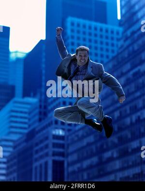 2005 HISTORICAL AIRBORNE OFFICE WORKER JUMPING IN MID AIR OFFICE BUILDINGS MANHATTAN NEW YORK CITY USA Stock Photo