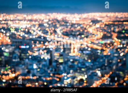 Bokeh of Cape Town skyline from Signal Hill after sunset during the blue hour - South Africa modern city with spectacular nightscape panorama Stock Photo