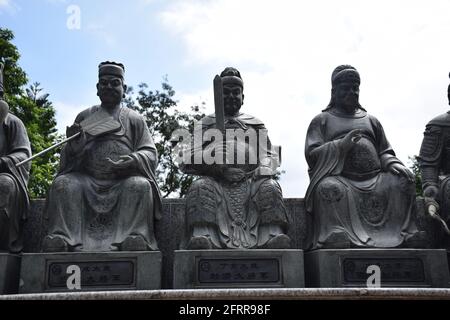 Stone statues inside Ten thousand Buddhas Monastery in Sha Tin area, Hong Kong - China Stock Photo