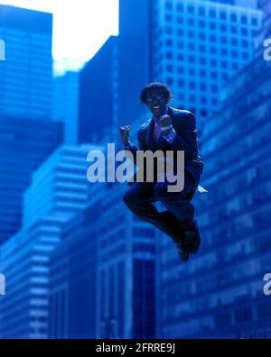 2005 HISTORICAL AIRBORNE OFFICE WORKER JUMPING IN MID AIR OFFICE BUILDINGS MANHATTAN NEW YORK CITY USA Stock Photo