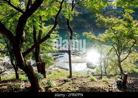 Side seeing riverside from sagano train in arashiyama ,river with sunlight green water. Stock Photo