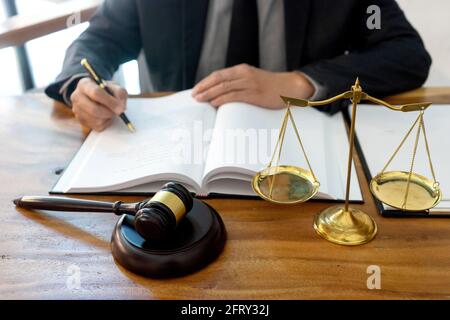 Judge or lawyer have gavel with  balance work in office  in law firm concept. Stock Photo