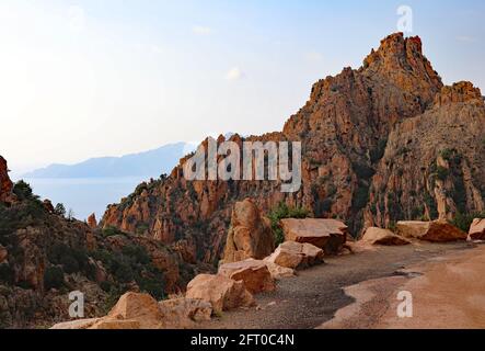 red badlands called Calanques de Piana in Corsica France with the road called D81 Stock Photo