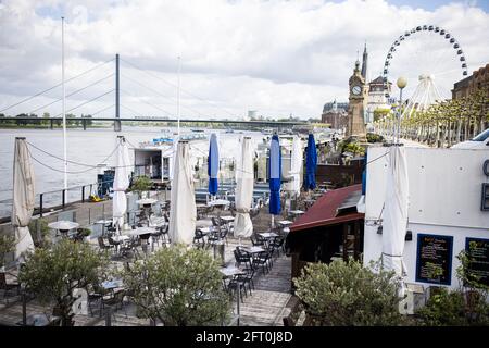 Duesseldorf, Germany. 21st May, 2021. View of the still empty casemates on the banks of the Rhine. After a month-long forced break, restaurateurs in Düsseldorf will be allowed to welcome guests again from Friday. As in other municipalities in NRW, this only applies to the outdoor area. Credit: Marcel Kusch/dpa/Alamy Live News Stock Photo