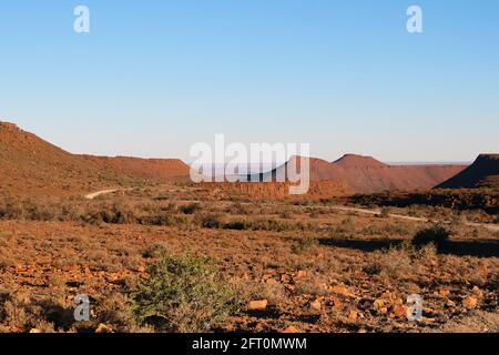 A winding road through deserted lands Stock Photo