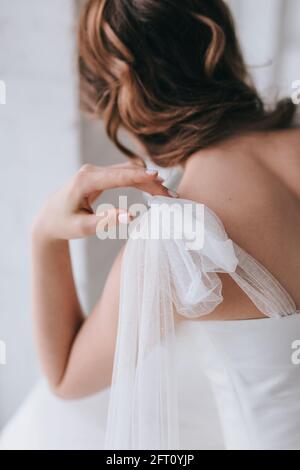 Close-up of beautiful stylish bride with an elegant hairstyle view from the back Stock Photo