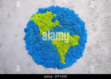 Planet Earth and continents, stabilized painted moss, gray background Stock Photo