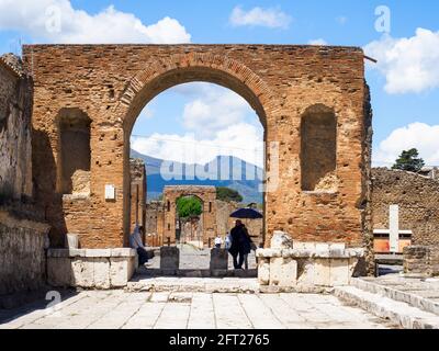 Honorary arch of Tiberius in the forum - Pompeii archaeological site, Italy Stock Photo