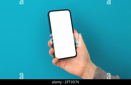 Mobile application screen mockup, person uses smartphone on a pastel background, copy space photo Stock Photo