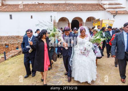 Bride, groom and guests at a traditional local wedding, Chinchero, a rustic Andean village in the Sacred Valley, Urubamba Province, Cusco Region, Peru Stock Photo