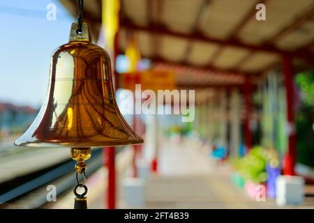 brass bell in tailandese train station for warning arrival-departure of train Stock Photo
