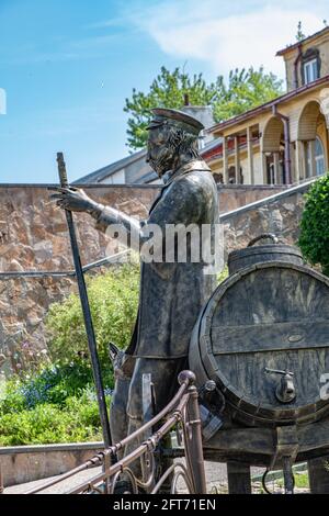 KOLOMNA, RUSSIA - MAY, 30, 2020: Monument to Kolomna water carrier with barrel, scale and dog in Kolomna, Russia Stock Photo