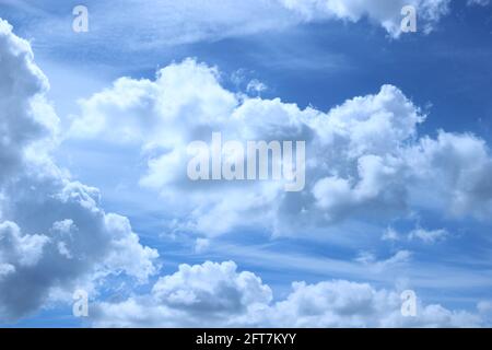 blue sky with white fluffy clouds Stock Photo