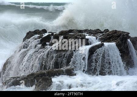 Wave break on rock Stock Photo