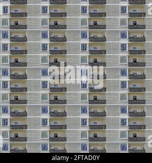 Repeated pattern of windows in monotonous skyscraper, abstract composite pattern and texture Stock Photo