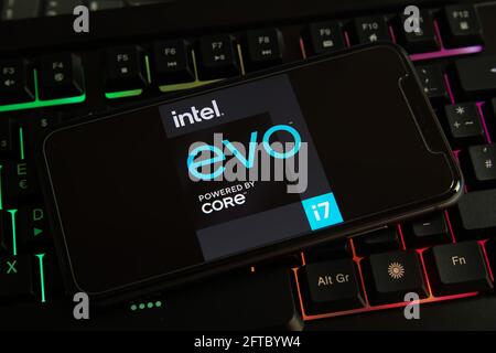 Viersen, Germany - May 9. 2021: Closeup of smartphone with logo lettering of intel evo i7 cpu on computer keyboard Stock Photo