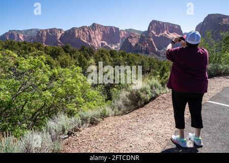Senior citizen woman photographs scenery in Utah Stock Photo