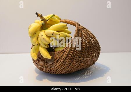 Ripe Bananas in a picnic basket Stock Photo