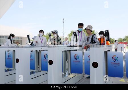 Shanghai. 21st May, 2021. People enter the exhibition zone of the 10th China Flower Expo in east China's Shanghai, May 21, 2021. The 10th China Flower Expo opened here on Friday, welcoming over 20,000 visitors on its first day.The expo, held to showcase the development of China's flower industry, will last until July 2. A total of 180 outdoor exhibition zones and 64 indoor areas have been set up at the expo park in the city's Chongming District. Credit: Fang Zhe/Xinhua/Alamy Live News Stock Photo