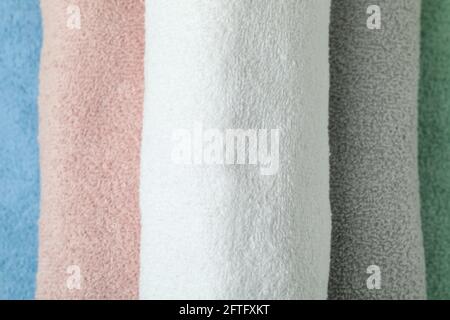 Clean multi colored rolled towels, close up Stock Photo