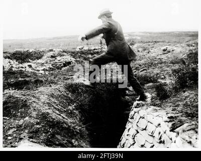 World War One, WWI, Western Front - The Lord Chief Justice Lord Reading jumps over a trench on the battlefield Stock Photo