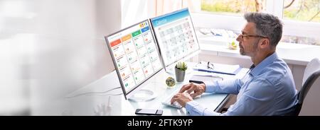 Gantt Tasks Schedule Chart On Computer In Office Stock Photo