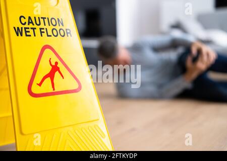 Slip Fall Accident. Floor Sign Caution And Safety Stock Photo