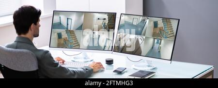 Watching Video From CCTV Security Cameras On Computer Stock Photo