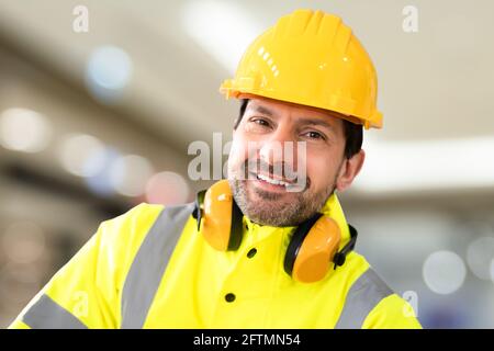 Young Worker Man With Hard Hat At Work Stock Photo