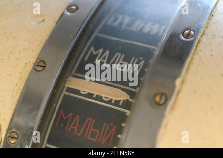 Navigational bridge on abandoned vessel. Old derelict ship wheelhouse. Ship's control device. Russian words: Ahead/Astern, full, half, slow, dead slow Stock Photo