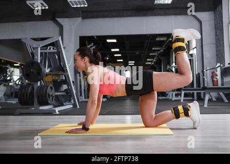 ankle weights donkey kicks form