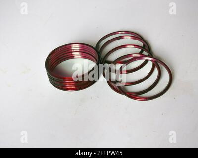 Group of traditional red glass bangles isolated on white background Stock Photo