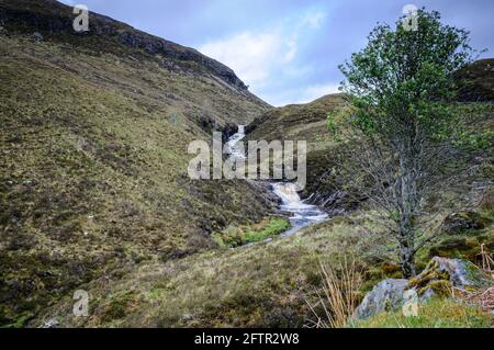 A summer, 3 shot, HDR image of the Dundonnell River flowing over waterfalls down the Dundonnell Gorge, Wester Ross, Scotland. 23 May 2014 Stock Photo