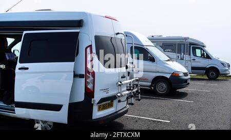 Campervans parked up in car park Stock Photo