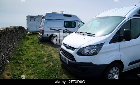 Campervans parked up in car park Stock Photo