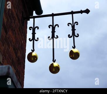 Traditional pawn brokers sign with three brass balls at Black Country Museum Dudley Stock Photo