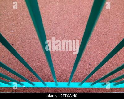 Green railings against red background abstract Stock Photo