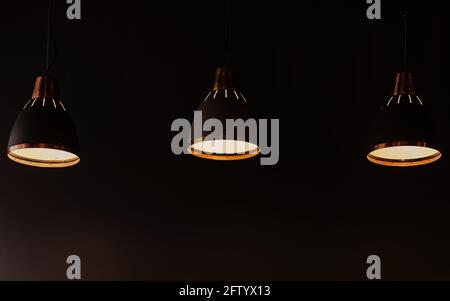 modern pendant lights in loft style. three hanging lamps Stock Photo