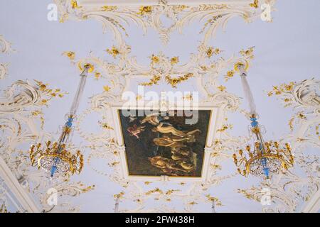 painting by Luca Giordano (1700s) on the ceiling between two chandeliers in oyer of the Hermitage Theatre, St petersburg, Russia Stock Photo