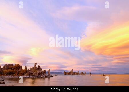 Fantastic colors over Mono Lake with lenticular clouds moving over it at a twilight Stock Photo
